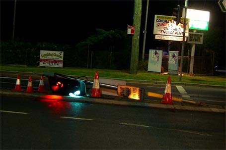 Traffic signals along the median strip knocked down, but still operating